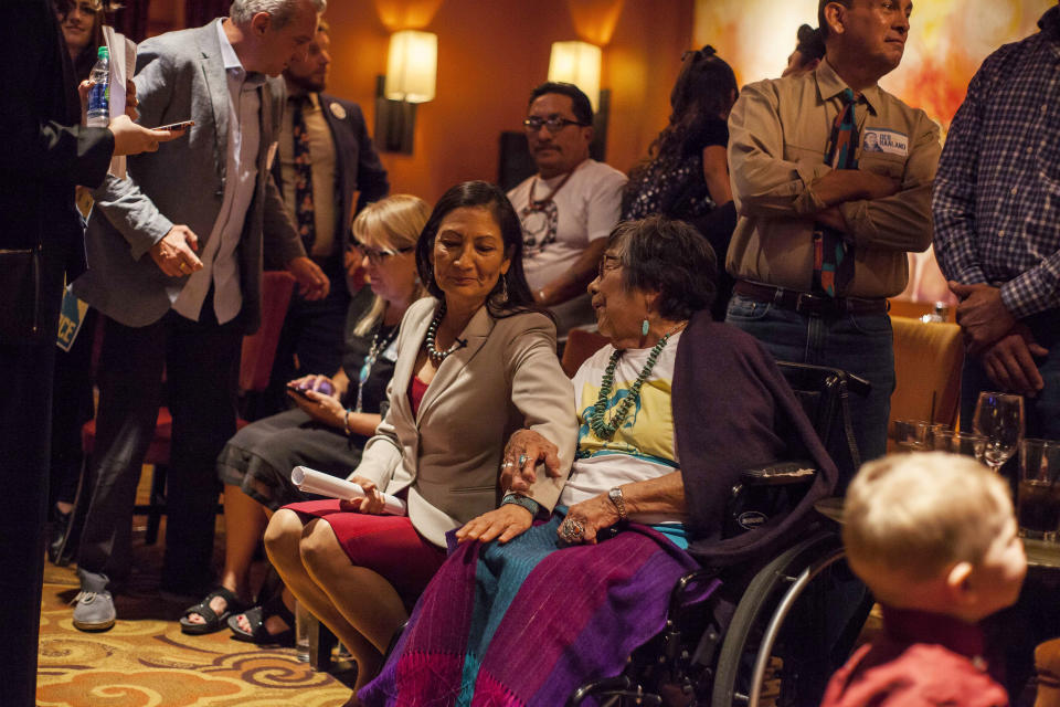 Congresswoman-elect Deb Haaland speaks to her mother Mary Toya following the news of her election during midterms' election night in Albuquerque, N.M., Tuesday, Nov. 6, 2018. (AP Photo/Juan Labreche)