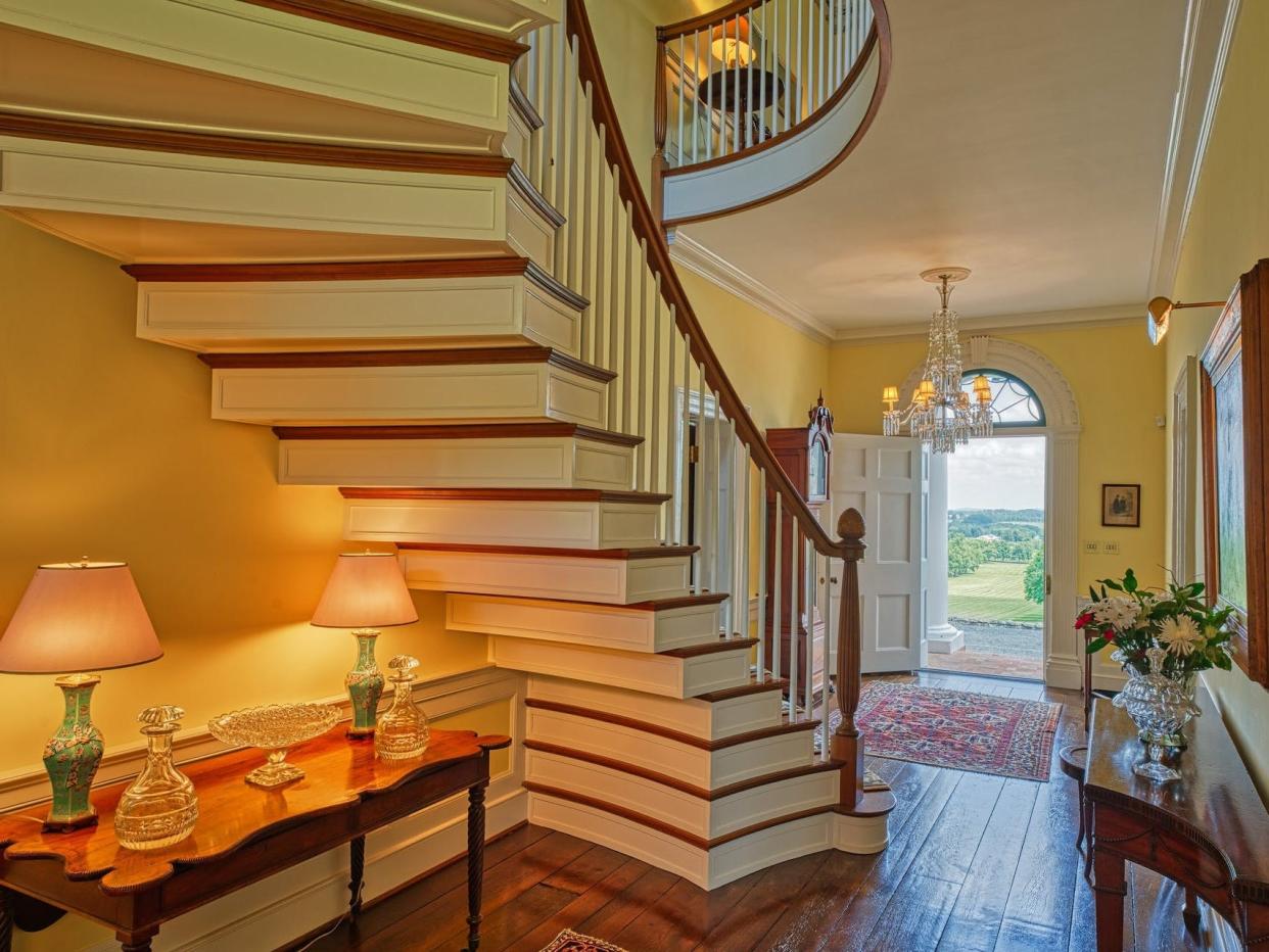 The grand staircase leading from the entrance of the main residence.