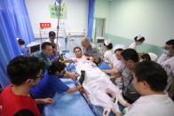 <p>A woman, injured during an earthquake, receives medical assistance at Mianyang Central Hospital in Mianyang in China’s southwestern Sichuan province on August 9, 2017, after an 6.5-magnitude earthquake struck the province late on Aug. 8. (Photo: STR/AFP/Getty Images) </p>