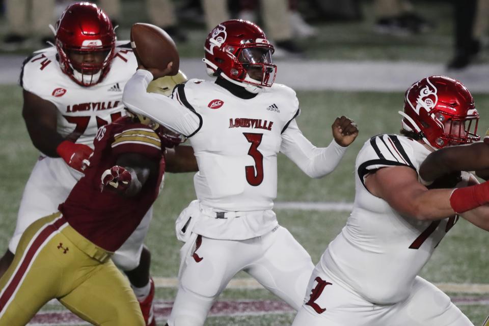Louisville quarterback Malik Cunningham (3) passes during the first half of an NCAA college football game against Boston College, Saturday, Nov. 28, 2020, in Boston. (AP Photo/Michael Dwyer)