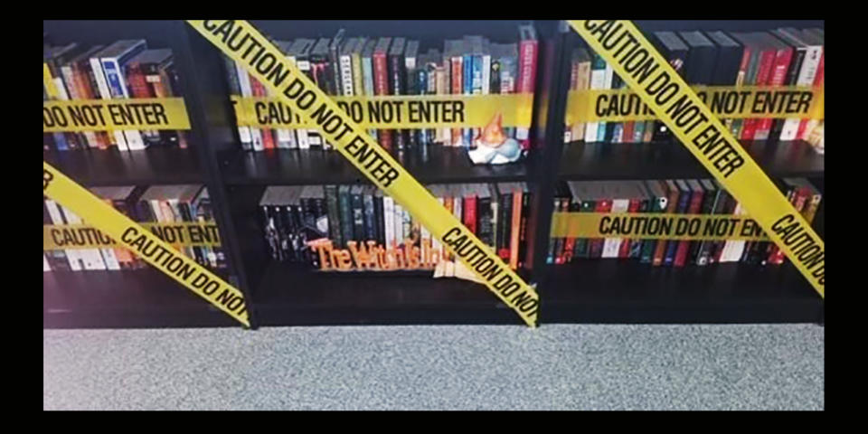 Image: A Carroll ISD teacher hung caution tape in front of the books in a classroom after the new policy was circulated. (Obtained by NBC News)