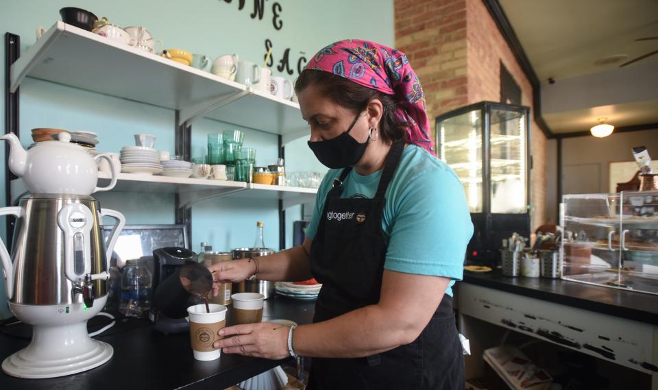 Burcay Gunguler, co-owner of Social Sloth Cafe and Bakery in downtown Lansing prepares Turkish coffee Tuesday, Sept. 7, 2021.