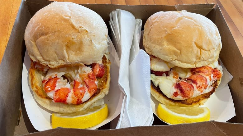 Two lobster rolls in a box