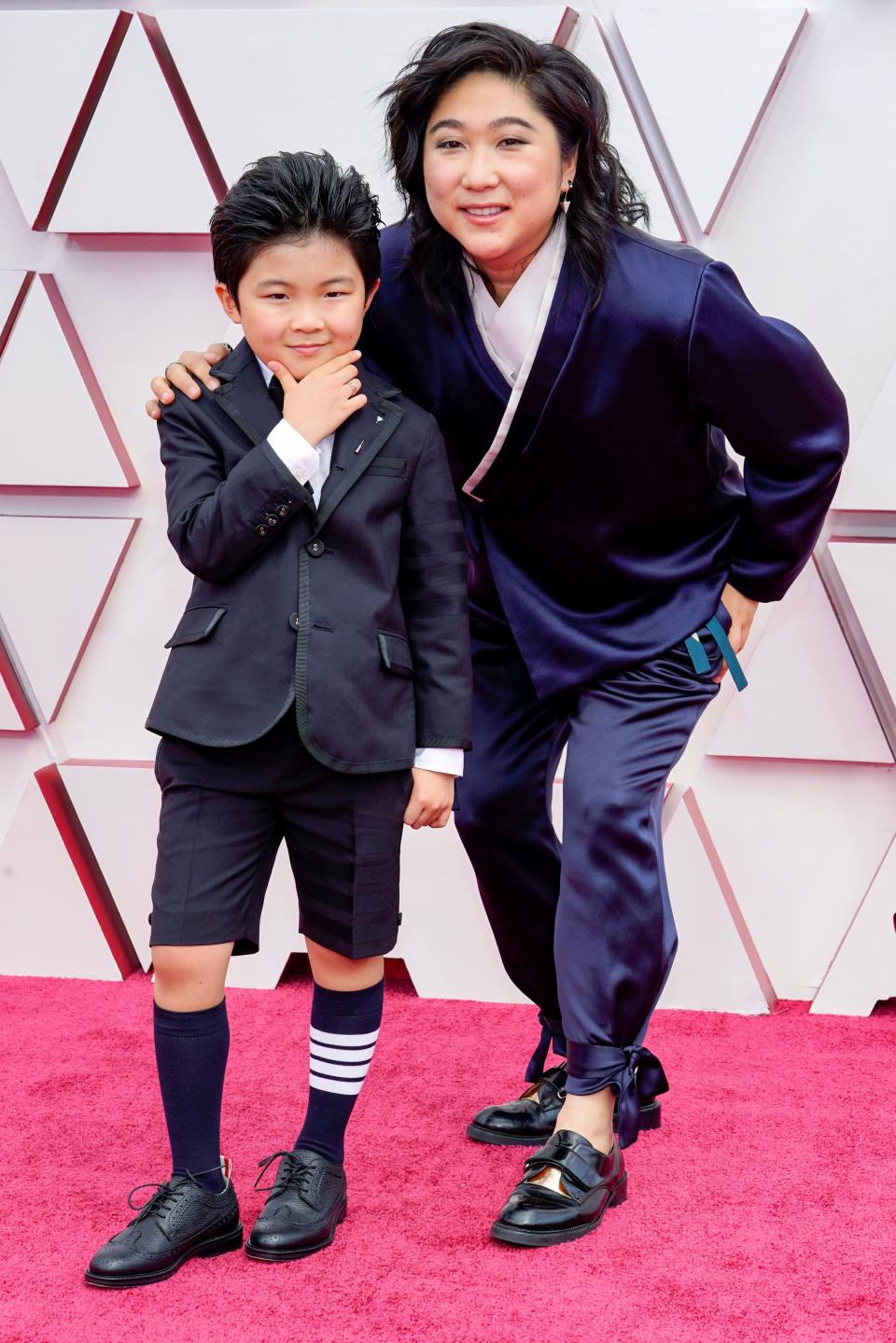 Alan S Kim wearing Thom Browne and Vicky Kim on the Oscars red carpetGetty