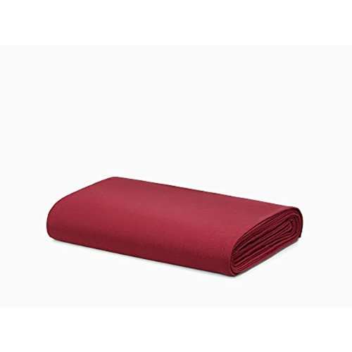 folded red top sheet for bed against white background