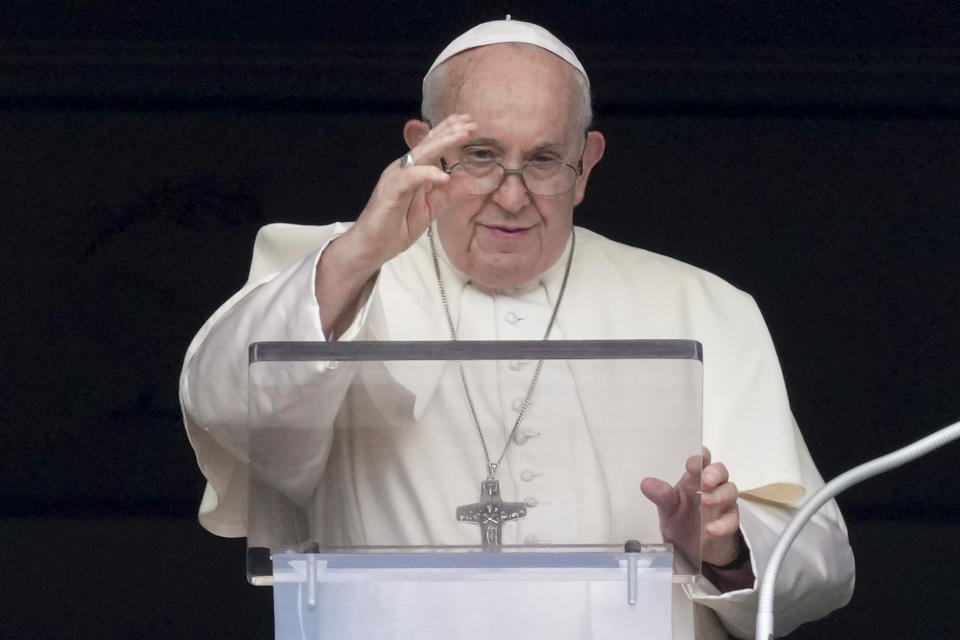 Pope Francis delivers his blessing as he recites the Angelus noon prayer from the window of his studio overlooking St.Peter's Square, at the Vatican, Sunday, Aug. 27, 2023. (AP Photo/Andrew Medichini)