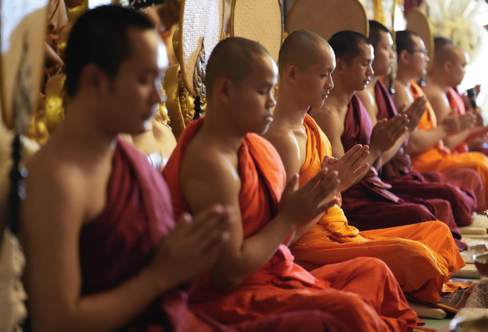 Thai Buddhist monks pray during a funeral ceremony for Duangphet Phromthep, one of the 12 boys rescued from a flooded cave in 2018, at Wat Phra That Doi Wao temple in Chiang Rai province, Thailand, Sunday, March 5, 2023. The cremated ashes of Duangphet arrived in the far northern Thai province of Chiang Rai on Saturday where final Buddhist rites for his funeral will be held over the next few days following his death in the U.K. (AP Photo/Sakchai Lalit)