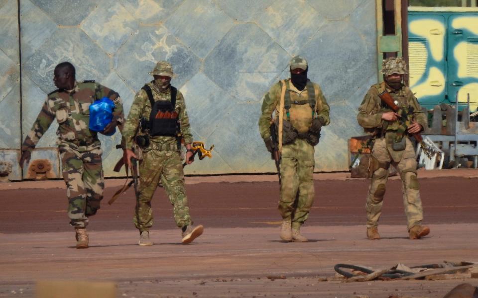 Three Russian mercenaries, right, in northern Mali. Around 1,400 Wagner Group mercenaries are estimated to be deployed in the country - French Army via AP