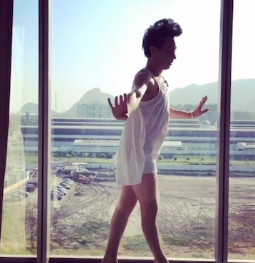 Johnny Weir recreates a balance beam routine. (Instagram)