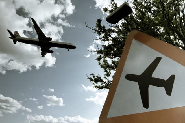 Airplane in flight near   Heathrow airport.