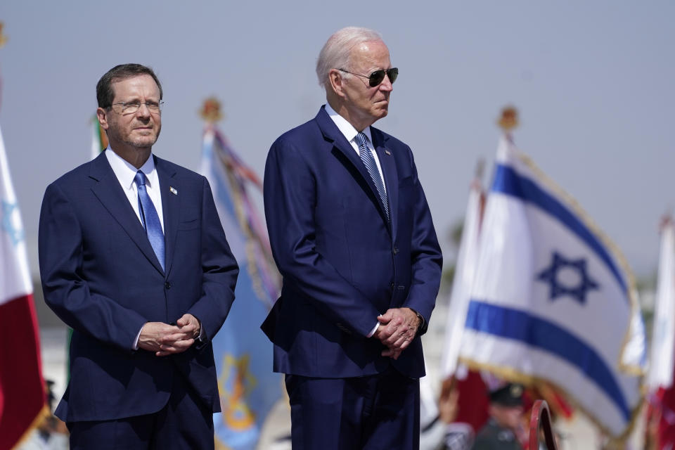 President Joe Biden stands with Israeli President Isaac Herzog, left, after arriving at Ben Gurion Airport, Wednesday, July 13, 2022, in Tel Aviv. (AP Photo/Evan Vucci)