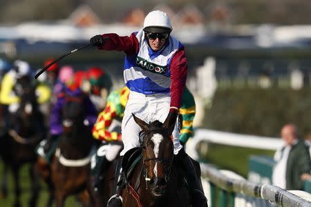 Britain Horse Racing - Grand National Festival - Aintree Racecourse - 8/4/17 Derek Fox on One For Arthur celebrates as he wins the 5:15 Randox Health Grand National Action Images via Reuters / Jason Cairnduff Livepic