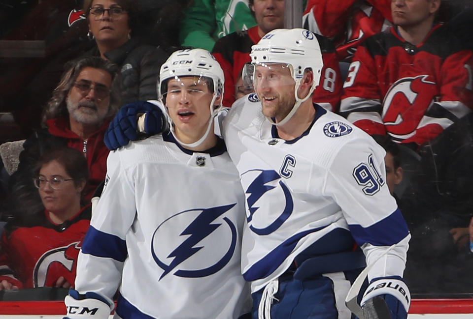 NEWARK, NEW JERSEY - DECEMBER 03: Yanni Gourde #37 of the Tampa Bay Lightning (l) celebrates his goal at 12:39 of the second period against the New Jersey Devils and is joined by Steven Stamkos #91 (r) at the Prudential Center on December 03, 2018 in Newark, New Jersey. (Photo by Bruce Bennett/Getty Images)