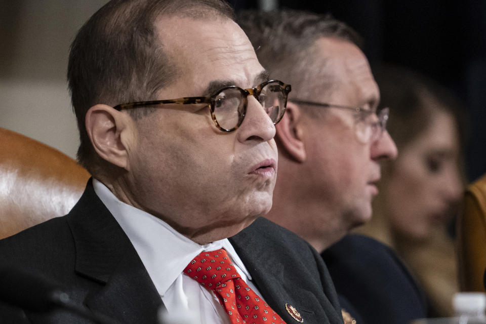 House Judiciary Committee Chairman Jerrold Nadler, D-N.Y., left, exhales after a day of work with Rep. Doug Collins, R-Ga., the ranking member, right, on the markup of articles of impeachment against President Donald Trump, Thursday, Dec. 12, 2019, on Capitol Hill in Washington. (AP Photo/J. Scott Applewhite)