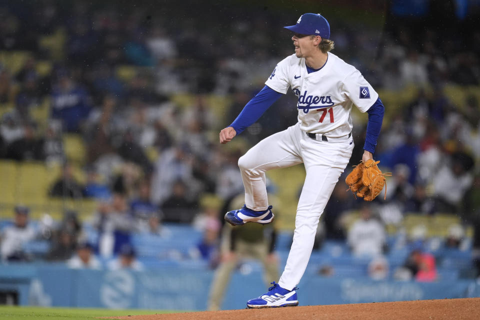 Los Angeles Dodgers starting pitcher Gavin Stone watches a throw to a San Diego Padres batter during the first inning of a baseball game Saturday, April 13, 2024, in Los Angeles. (AP Photo/Marcio Jose Sanchez)