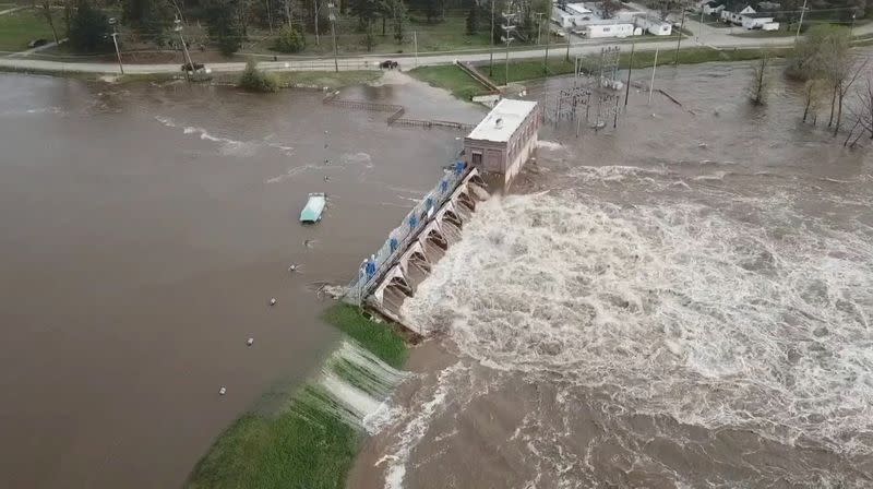 An aerial view of flooding as water overruns Sanford Dam, Michigan, U.S. in this May 19, 2020 still frame obtained from social media video