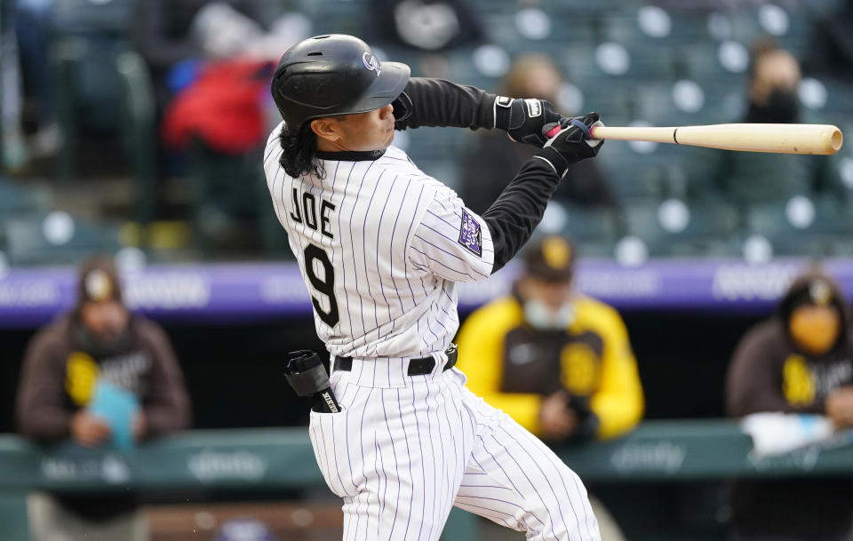 Colorado Rockies' Connor Joe checks his swing while facing San Diego Padres starting pitcher Dinelson Lamet during the second inning of a baseball game Tuesday, May 11, 2021, in Denver. (AP Photo/David Zalubowski)