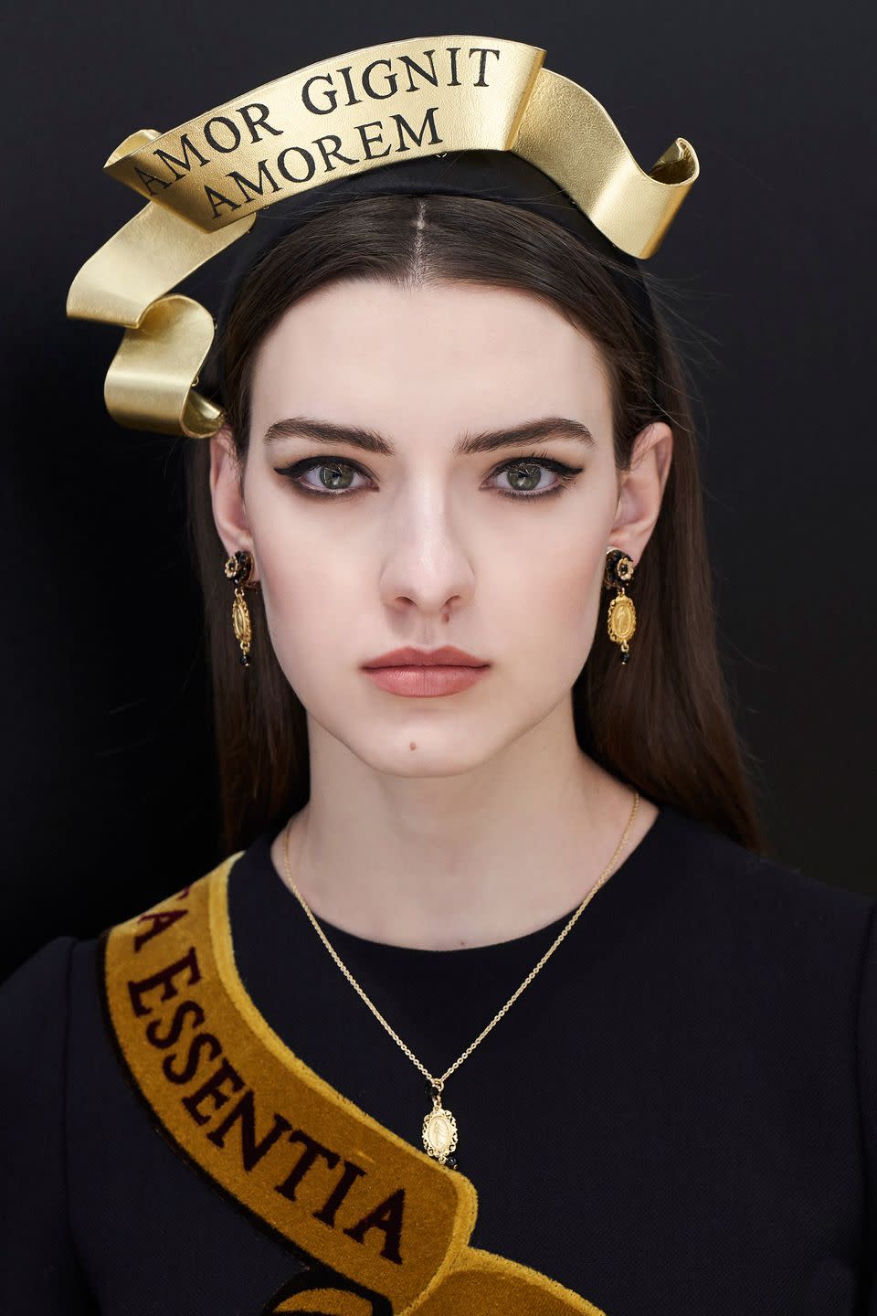 <p><strong>Trend: polished skin</strong></p><p>The make-up at Dolce & Gabbana was used to complement the collection's 'Fashion Devotion' theme, which was based on the new way in which Millennials lead fashion. In reality, that translated as fresh and polished complexions, eyes defined by graphic eyeliner and brown eyeshadow and perfectly plump lips. </p><p>For a flawless base, use Dolce & Gabbana's <a rel="nofollow noopener" href="https://www.harrods.com/en-gb/dolce-and-gabbana-make-up/perfect-matte-liquid-foundation-p000000000003128681" target="_blank" data-ylk="slk:Matte Liquid Foundation;elm:context_link;itc:0;sec:content-canvas" class="link ">Matte Liquid Foundation</a>, £43, alongside the <a rel="nofollow noopener" href="https://www.harrods.com/en-gb/dolce-and-gabbana-make-up/blush-of-roses-creamy-face-colour-p000000000005347705" target="_blank" data-ylk="slk:Creamy Blush;elm:context_link;itc:0;sec:content-canvas" class="link ">Creamy Blush</a> and <a rel="nofollow noopener" href="http://www.dolcegabbana.com/beauty/makeup/face-products/blush-of-roses/" target="_blank" data-ylk="slk:Creamy Illuminator;elm:context_link;itc:0;sec:content-canvas" class="link ">Creamy Illuminator</a>, both £40, for a lit-from-within glow (no Instagram filter required). Across your eyelids and lash lines, try <a rel="nofollow noopener" href="https://www.harrods.com/en-gb/dolce-and-gabbana-make-up/perfect-mono-eye-colour-p000000000004179033" target="_blank" data-ylk="slk:Perfect Mono Eyeshadow in Desert;elm:context_link;itc:0;sec:content-canvas" class="link ">Perfect Mono Eyeshadow in Desert</a>, £27 - before creating your flicks with <a rel="nofollow noopener" href="https://www.harrods.com/en-gb/dolce-and-gabbana-make-up/emotion-eyes-eyeliner-stylo-black-p000000000005801290?colour=brown" target="_blank" data-ylk="slk:Emotioneyes High Definition Eyeliner Stylo;elm:context_link;itc:0;sec:content-canvas" class="link ">Emotioneyes High Definition Eyeliner Stylo</a>, £27. Finish, with a <a rel="nofollow noopener" href="https://www.harrods.com/en-gb/dolce-and-gabbana-make-up/classic-cream-lipstick-p000000000001998185?colour=pink" target="_blank" data-ylk="slk:Classic Cream Lipstick;elm:context_link;itc:0;sec:content-canvas" class="link ">Classic Cream Lipstick</a>, £27, in either a neutral or red shade. </p>