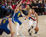 May 20, 2019; Portland, OR, USA; Portland Trail Blazers guard CJ McCollum (3) is double teamed in the second half by Golden State Warriors center Andrew Bogut (12) and guard Stephen Curry (30) in game four of the Western conference finals of the 2019 NBA Playoffs at Moda Center. The Warriors won 119-117 in overtime. Mandatory Credit: Troy Wayrynen-USA TODAY Sports