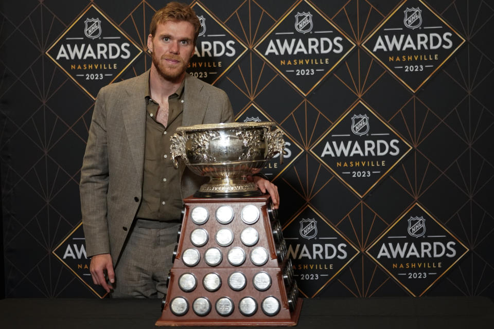 Edmonton Oilers hockey player Connor McDavid poses with the Art Ross Trophy at the NHL Awards, Monday, June 26, 2023, in Nashville, Tenn. (AP Photo/George Walker IV)