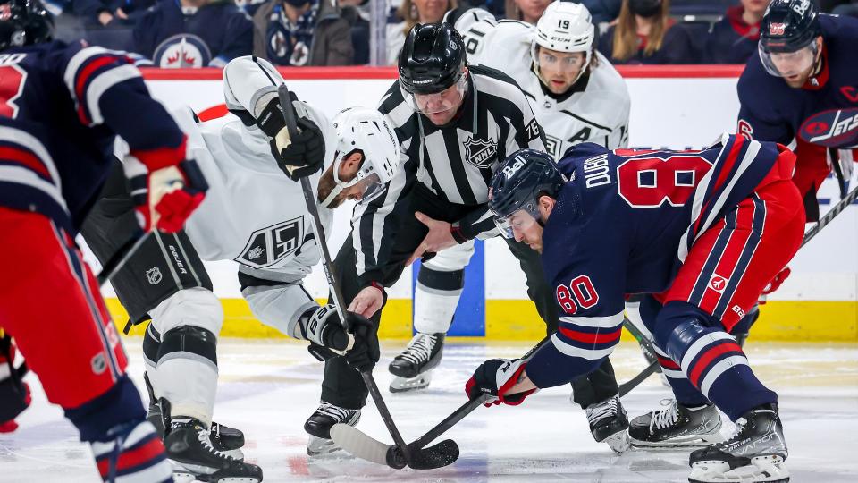 WINNIPEG, MB - APRIL 2: Anze Kopitar #11 of the Los Angeles Kings takes a second period face-off against Pierre-Luc Dubois #80 of the Winnipeg Jets at the Canada Life Centre on April 2, 2022 in Winnipeg, Manitoba, Canada. (Photo by Jonathan Kozub/NHLI via Getty Images)