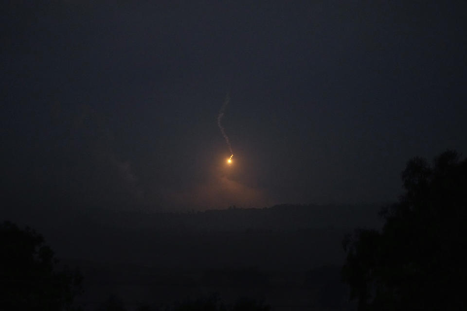 An Israeli army flare is seen over the Gaza Strip, as seen from southern Israel, Monday, Nov. 13, 2023. (AP Photo/Ohad Zwigenberg)