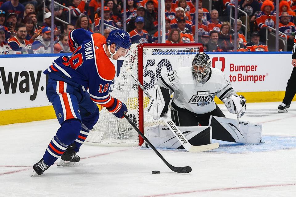 Kings Goalie Cam Talbot positions himself to stop a shot by Oilers forward Zach Hyman.