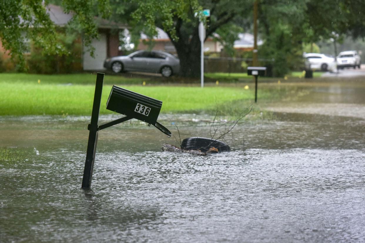 A mailbox stands in floodwaters from heavy rains that have plagued the region in recent days on Foxboro Drive in northeast Jackson, Miss.