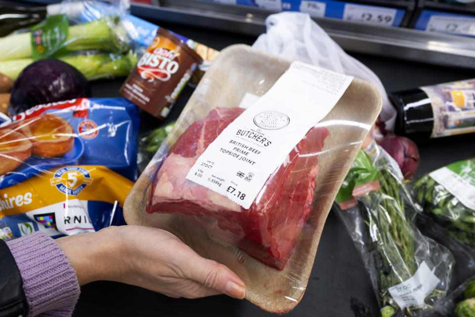 CARDIFF, WALES - OCTOBER 23: In this photo illustration, produce used in a traditional Sunday roast dinner including a joint of beef is loaded onto a conveyor belt at the pay desk on October 23, 2022 in Cardiff, Wales. The cost of a home-cooked Sunday roast for a family of four has reached its highest level in over a decade with inflation at 10.1%. (Photo by Matthew Horwood/Getty Images)