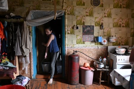 The Wider Image: Russian village's last teacher stays on for her one remaining pupil