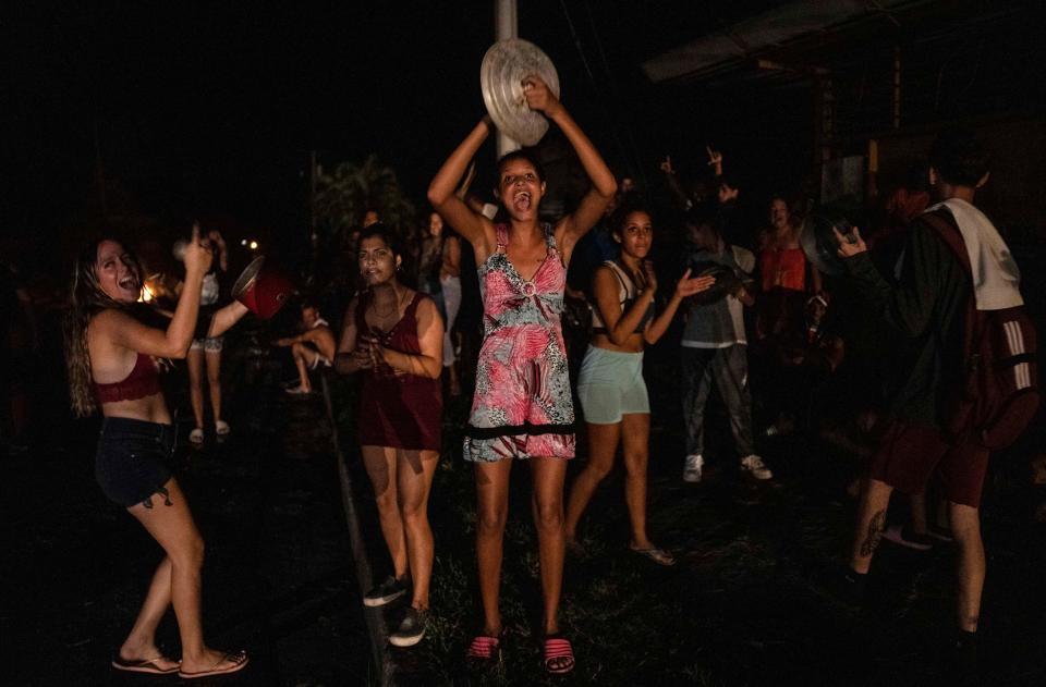 People protest, asking for the restoration of electrical service after four days of blackout due to the devastation of Hurricane Ian in Bacuranao, Cuba, Friday, Sept. 30, 2022.