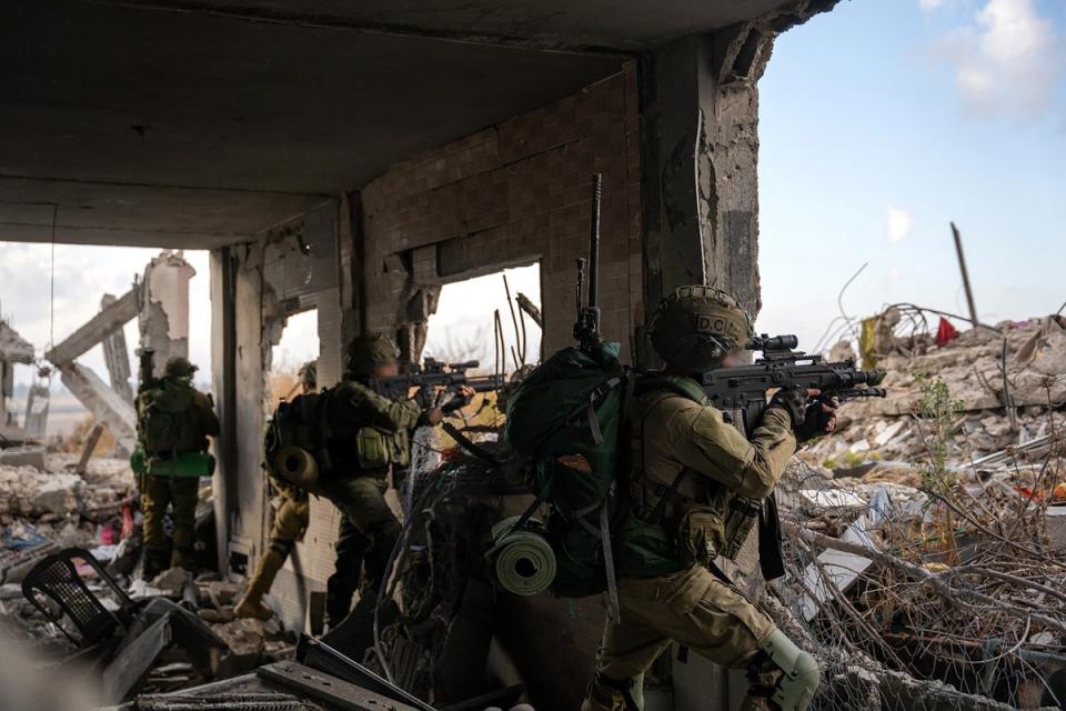 This handout picture released by the Israeli army on 14 May shows Israeli soldiers during military operations in the Gaza Strip (Israeli Army/AFP via Getty)