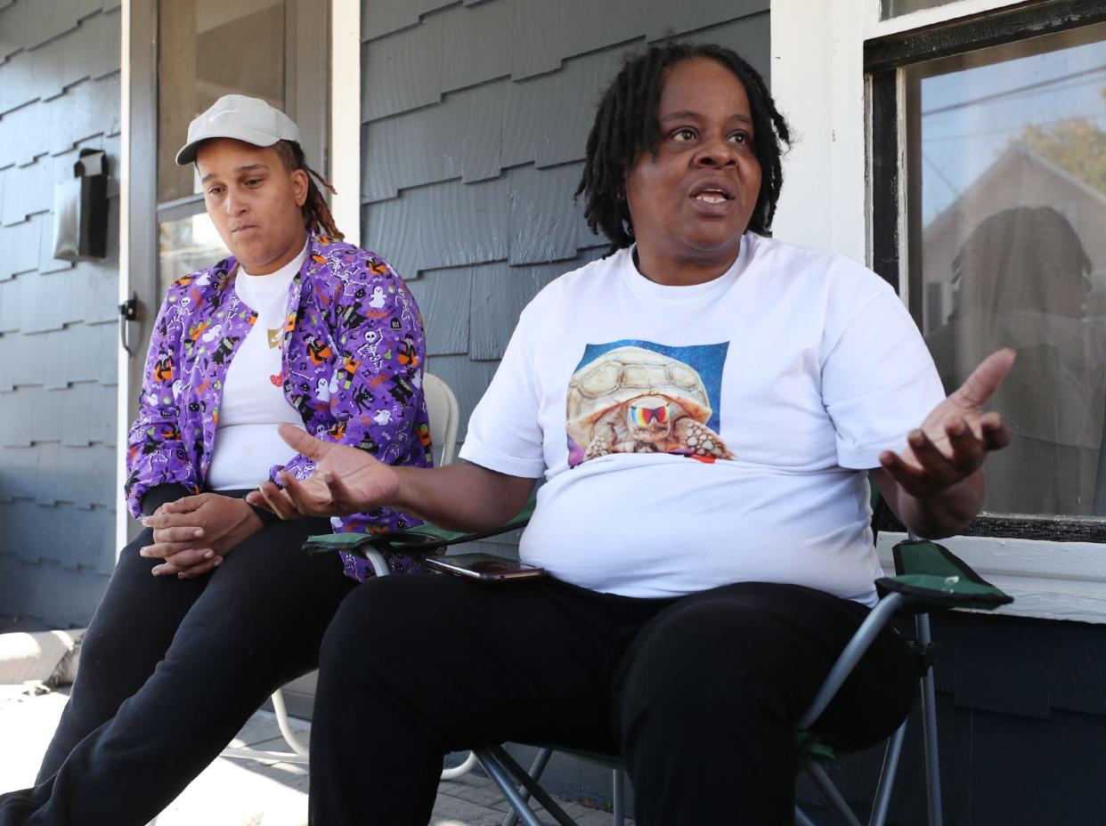 LaToya Synder sits with her mother, Tracy Snyder, as Tracy talks about killing of her grandson 17-year-old Antenio "Teno" Louis, was shot dead in Akron while catching a ride to football practice.