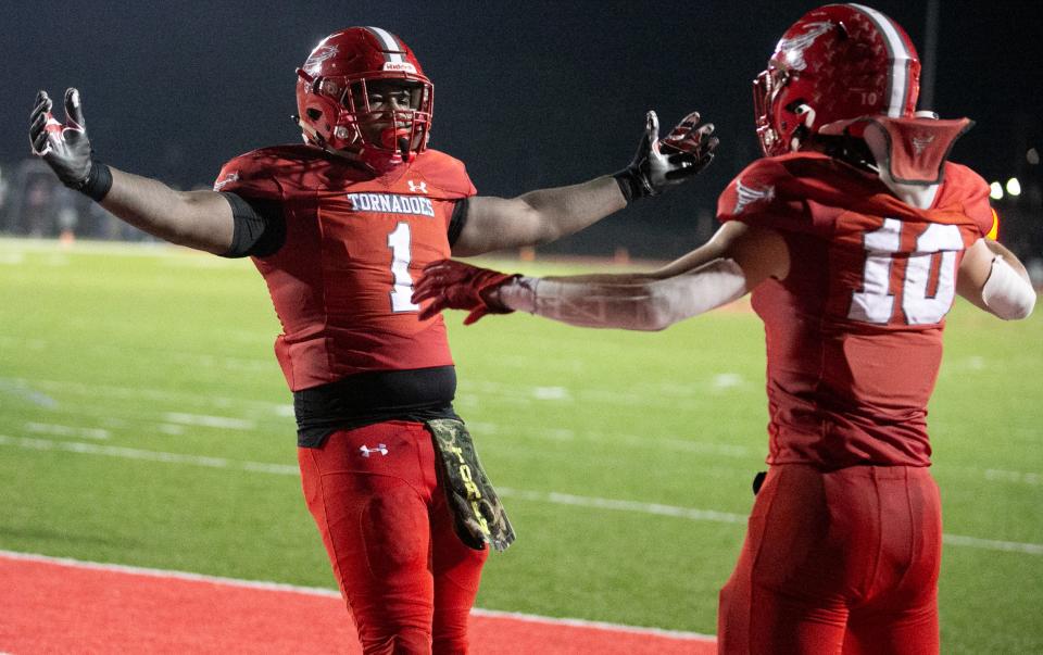 Bradford High School Torin Brazell (1) celebrates a touchdown with Bradford High School Chason Clark (10) during second half action as Bradford takes on Pensacola Catholic during a play off game in the 2023 FHSAA Football State Championship at Bradford High School in Starke, FL on Friday, December 1, 2023. Bradford won 22-21 in overtime after making the two point conversion. They will play for the state championship in Tallahassee. [Alan Youngblood/Gainesville Sun]