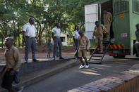 Street currency dealers make a court appearance at the magistrates courts in Harare, Zimbabwe, Thursday, April 25, 2024. Authorities in Zimbabwe are resorting to force to defend the new currency, including packing jail cells with dozens of street currency dealers and freezing accounts of hordes of businesses accused of undermining the value of the ZiG. (AP Photo/Tsvangirayi Mukwazhi)