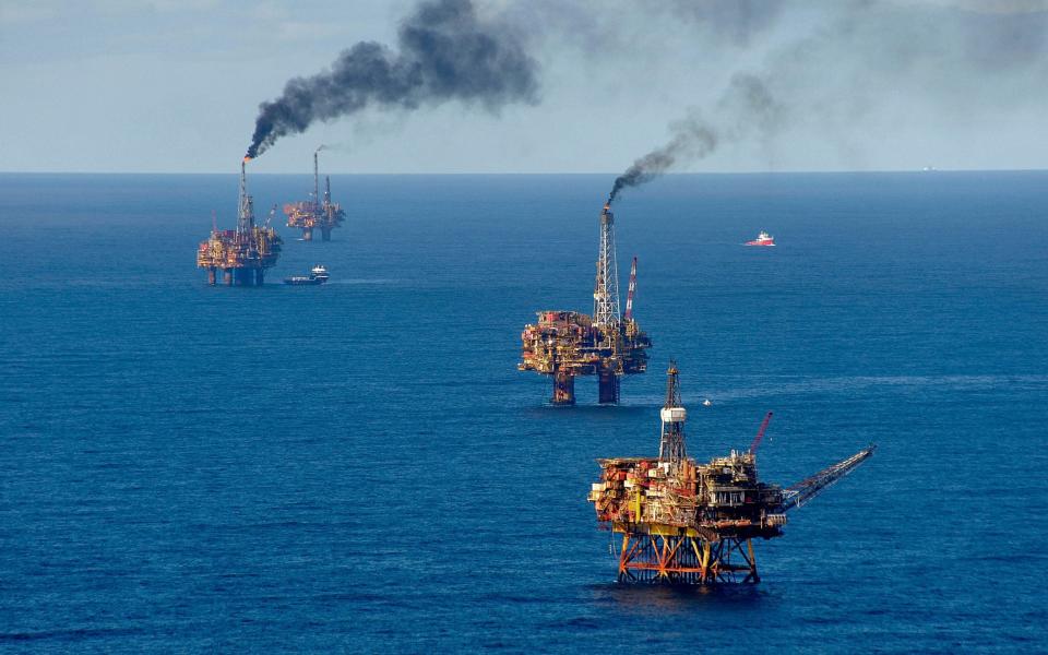 Oil production platforms at the Brent oil field in the North Sea - Martin Langer / Alamy Stock Photo