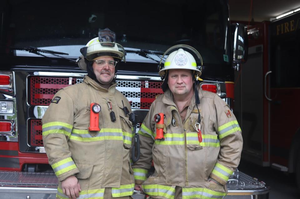 Deputy Chief Davis Gallant, left, and Chief Ron Phillips say that going through the old photos is a chance to learn more about the history of the department.