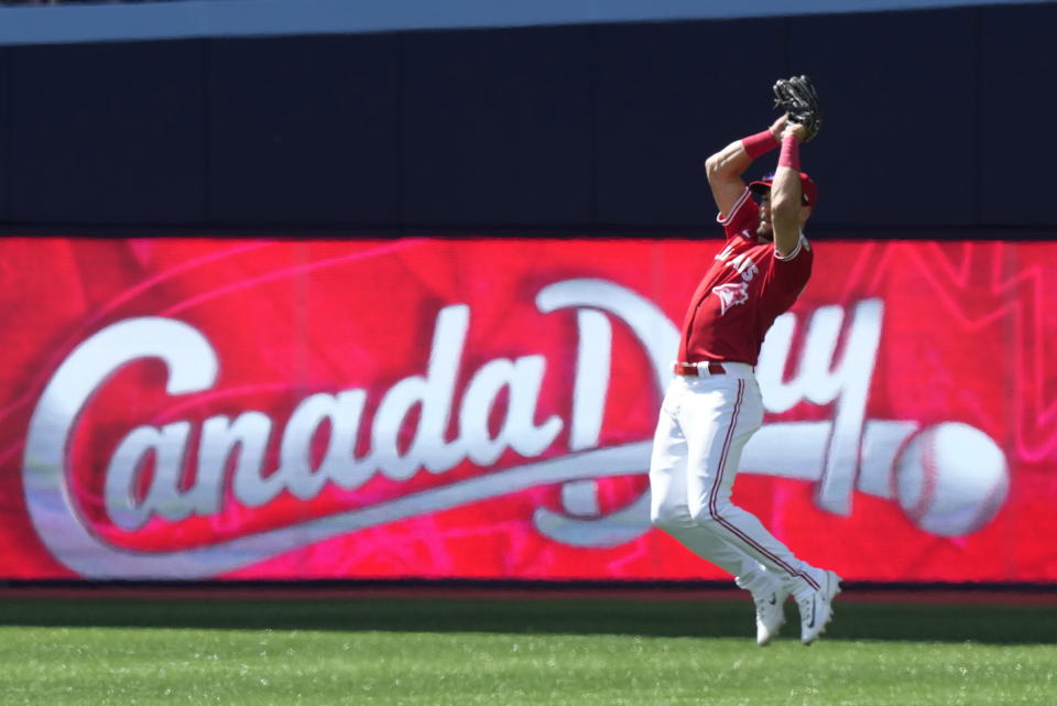 Toronto Blue Jays center fielder Kevin Kiermaier jumps to catch a pop fly by Houston Astros' Jeremy Pena during second-inning baseball game action in Toronto, Monday, July 1, 2024. (Frank Gunn/The Canadian Press via AP)