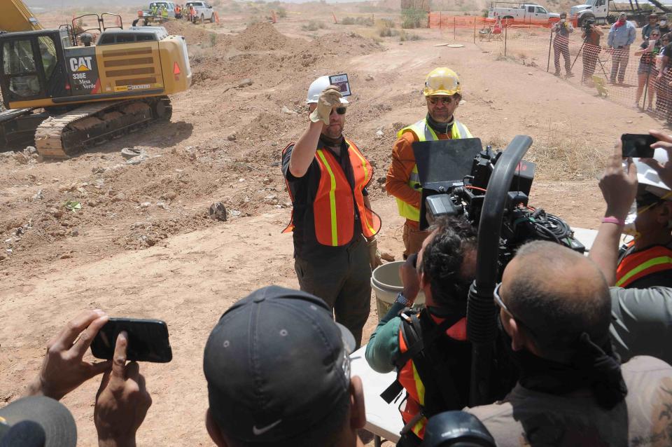 Workers show the media the first recovered "E.T. the Extra-Terrestrial" cartridge at the old Alamogordo landfill in Alamogordo