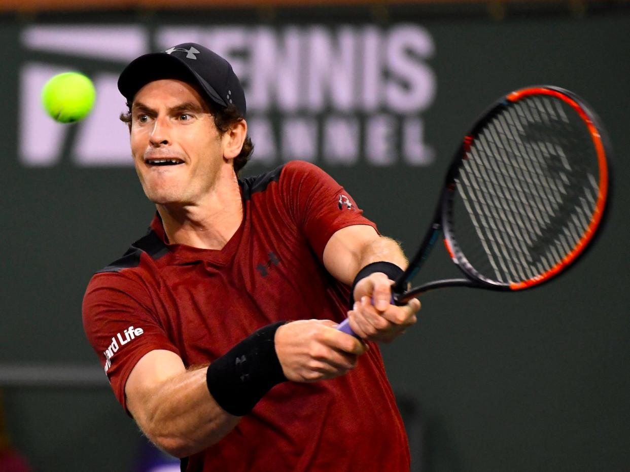 Andy Murray, of Great Britain, returns a shot to Vasek Pospisil, of Canada, at the BNP Paribas Open tennis tournament, Saturday, March 11, 2017, in Indian Wells, Calif. Pospisil won the match 6-4, 7-6 (5). (AP Photo/Mark J. Terrill)