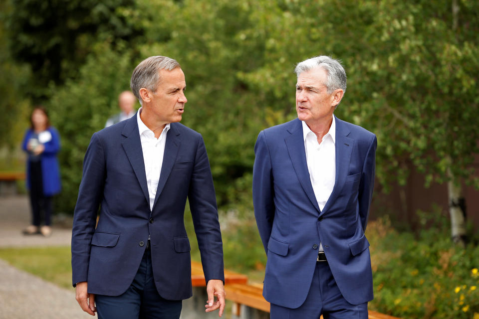 Federal Reserve Chair Jerome Powell and Governor of the Bank of England, Mark Carney, are seen during the three-day "Challenges for Monetary Policy" conference in Jackson Hole, Wyoming, U.S., August 23, 2019.  REUTERS/Jonathan Crosby