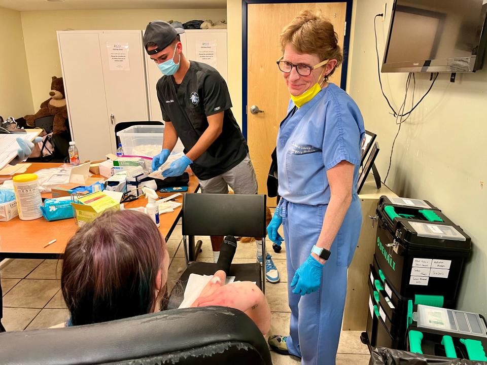 Dr. Sandra Gibney treats a woman who has a xylazine wound at a wound care clinic at Brandywine Counseling & Community Services on Thursday, April 20, 2023. Xylazine, an animal tranquilizer, is being mixed with fentanyl. It causes horrific wounds on users' bodies.