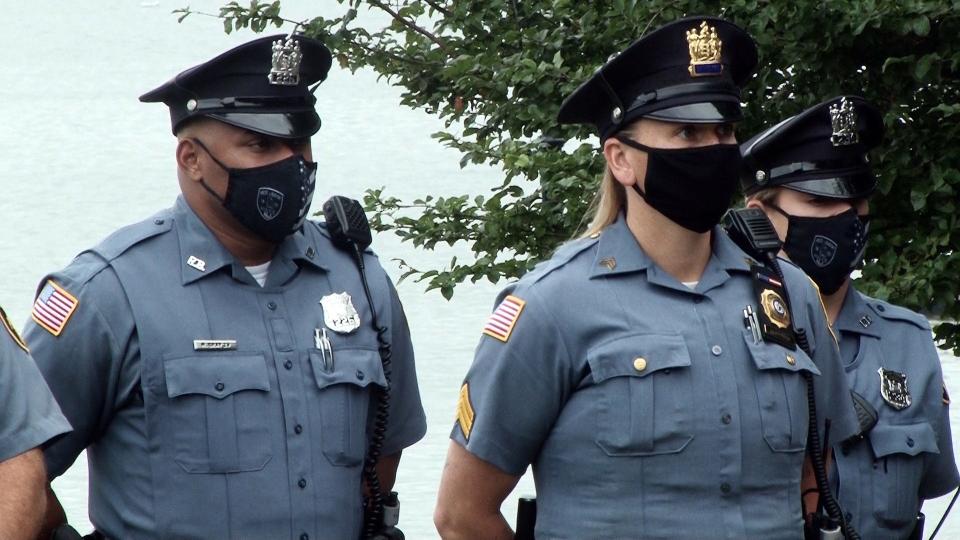 Members of the Red Bank Police and Fire Departments gather at Riverside Gardens for a Patriot Day observance commemorating the Sept. 11th attacks