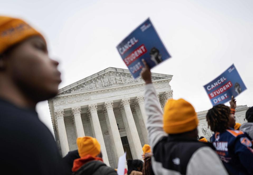 Activists and students protest in front of the Supreme Court during a rally for student debt cancellation in Washington, DC, Fe. 28, 2023.