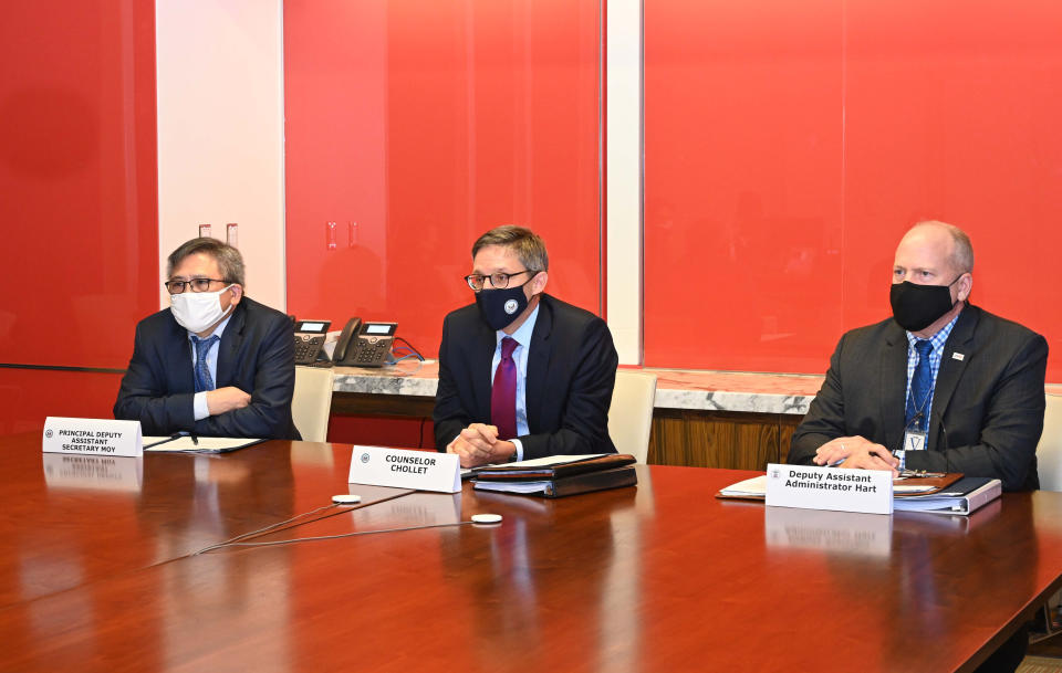 In this photo released by U.S. Embassy in Indonesia, Derek Chollet, center, counselor of the U.S. Department of State, with Kin Moy, left, principal deputy assistant secretary for the Bureau of East Asian and Pacific Affairs, and Craig Hart, U.S. deputy assistant administrator for East Asia and the Pacific, attends an exclusive interview with The Associated Press at the embassy in Jakarta, Indonesia, Thursday, Oct. 21, 2021. Chollet said that the U.S. is at an “inflection point” for how to handle the continued crisis in Myanmar. The U.S. has been one of the most vocal opponents of the military takeover that ousted Aung San Suu Kyi’s elected government in February. Chollet says that there are political and economic “levers” that can be used. (U.S. Embassy in Indonesia via AP)