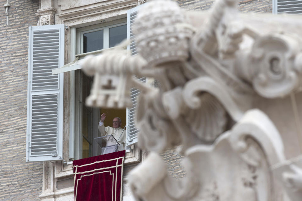 Pope Francis blesses faithful during the Angelus prayer from his studio window overlooking St. Peter's Square at the Vatican, Sunday, March 2, 2014. Pope Francis is urging all segments of Ukrainian society to work to overcome incomprehension and build a future together. Francis spoke of what he called Ukraine's "delicate" situation after he greeted thousands of people in St. Peter's Square for his traditional Sunday midday appearance. (AP Photo/Alessandra Tarantino)