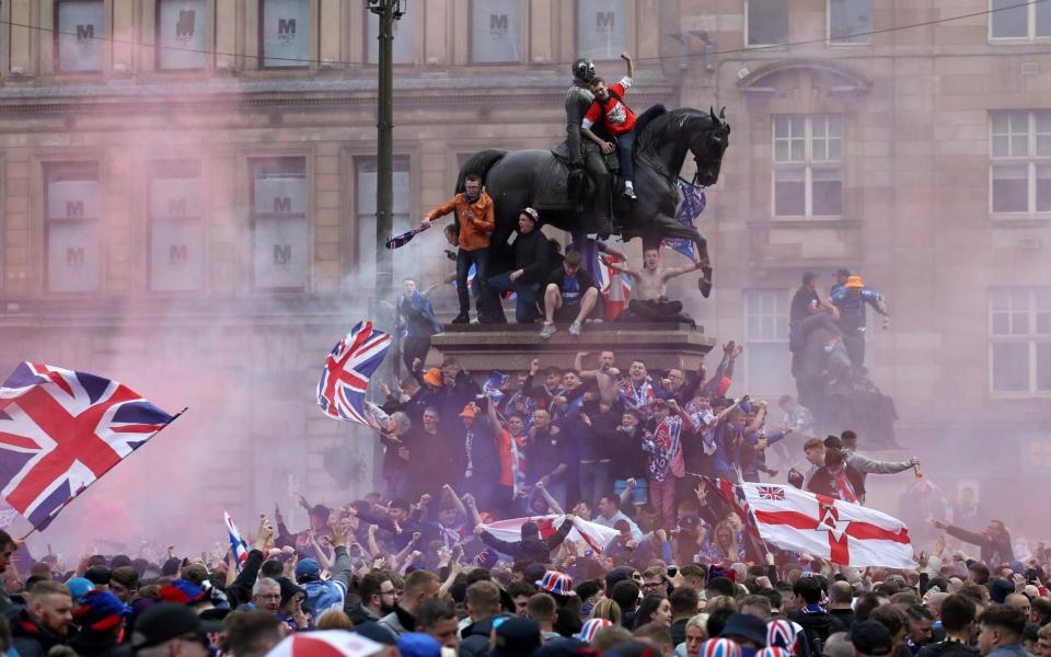 Rangers fans celebrate winning the Scottish Premiership in George Square, Glasgow, - Andrew Milligan/PA