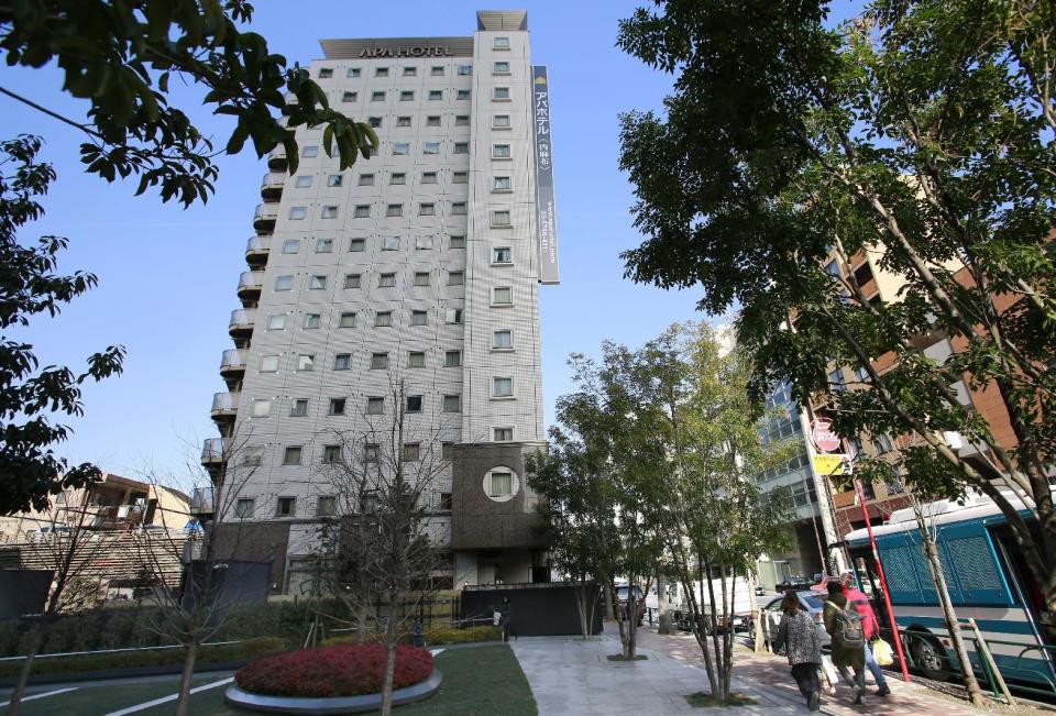 An Apa Hotel stands in Tokyo, Wednesday, Jan. 18, 2017. The fast-growing Japanese hotel chain is facing criticism over a book penned by the hotel’s owner that says the Rape of Nanking was fabricated. APA Group, a Tokyo-based land developer and operator of 400-plus hotels, drew fire for spreading the revisionist views of company president Toshio Motoya by putting the books in hotel guestrooms and also selling them. (AP Photo/Shizuo Kambayashi)