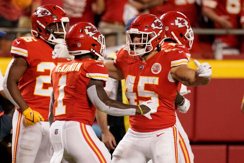 Kansas City Chiefs running back Jerick McKinnon (1) is congratulated by fullback Michael Burton (45) after scoring during the first half of an NFL football game against the Los Angeles Chargers Thursday, Sept. 15, 2022, in Kansas City, Mo. (AP Photo/Charlie Riedel)
