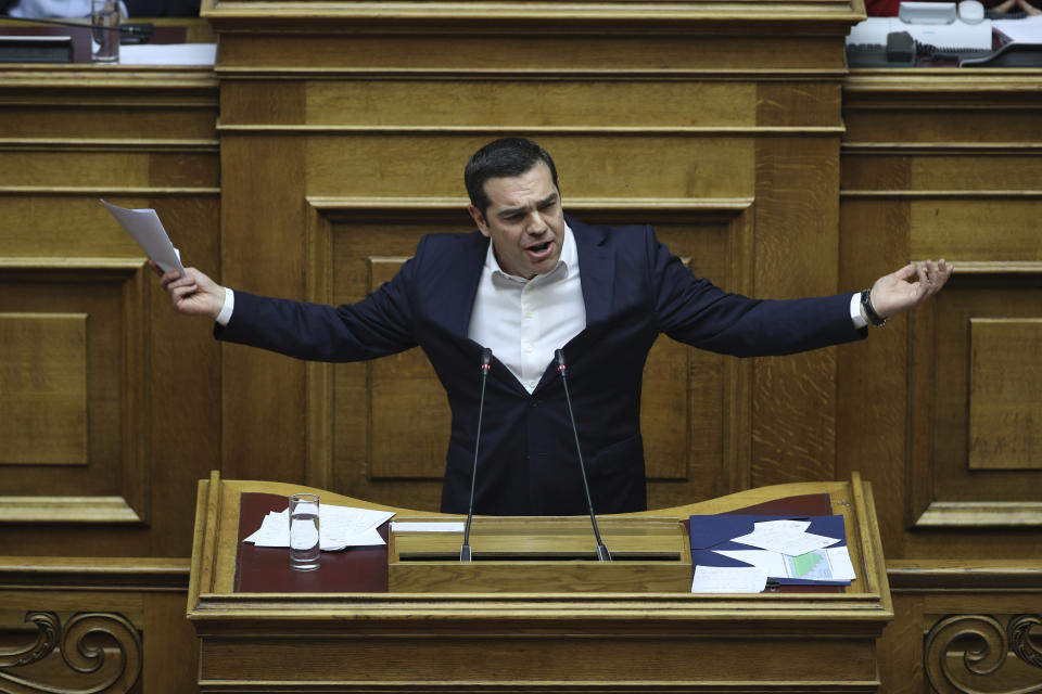 Greek Prime Minister Alexis Tsipras speaks during a parliament session in Athens on Tuesday, Dec. 18, 2018. Greek lawmakers are debating the heavily-indebted country's draft budget for 2019, the first since Greece exited an eight-year bailout program.(AP Photo/Petros Giannakouris)